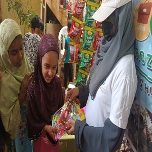 girl volunter Distributing toys